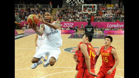 British forward Drew Sullivan, left, jumps to score during the men's basketball preliminary round match between Great Britain and China on Monday, August 6. Great Britain won 90-58.