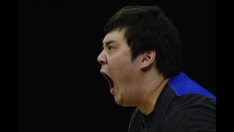 South Korea's Kim Whaseung shouts as he competes during the men's 105-kilogram group A weightlifting event.