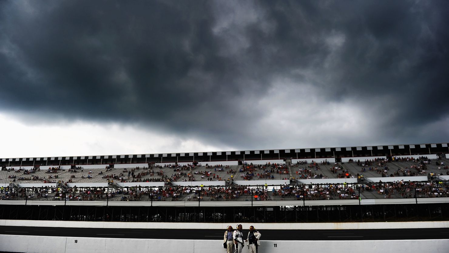 Dark clouds form over the racetrack before the start of the NASCAR Sprint Cup Series Pennsylvania 400 at Pocono Raceway.