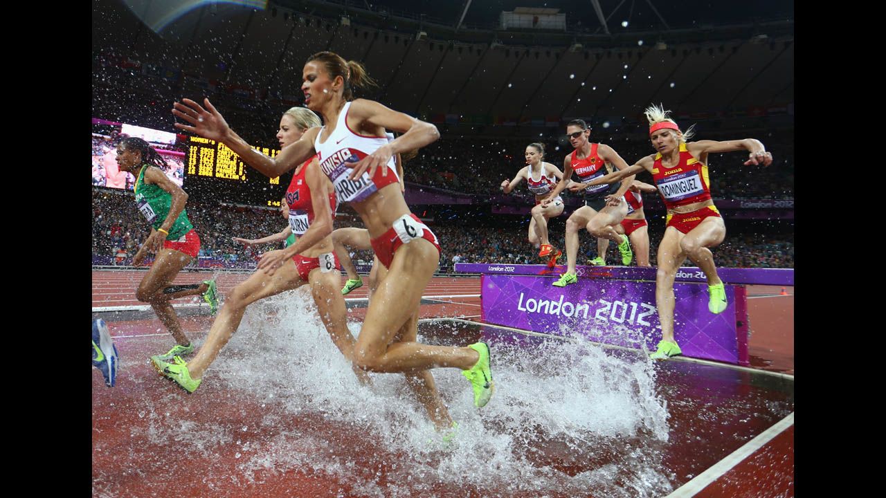 Athletes compete in the women's 3,000-meter steeplechase final.