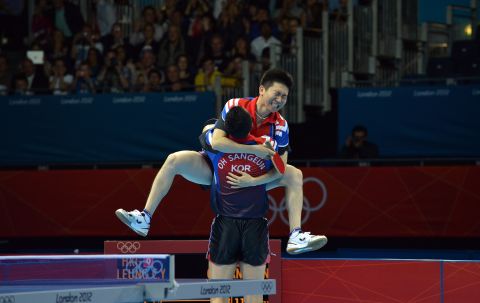 South Korea pair Oh Sangeun and Seungmin Ryu celebrate their team victory over Hong Kong after the men's team table tennis semifinal.