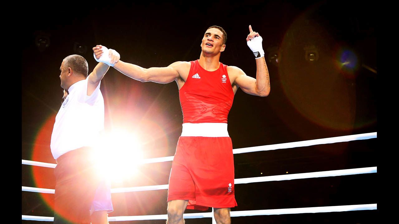 Anthony Ogogo of Great Britain celebrates his victory over Stefan Hartel of Germany during the men's middle 75-kilogram boxing.