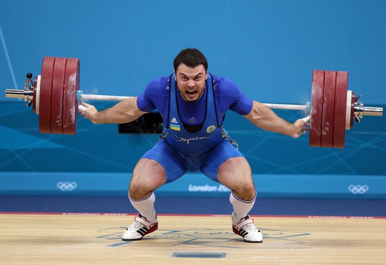 Oleksiy Torokhtiy of Ukraine competes in the men's 105-kilogram weightlifting.