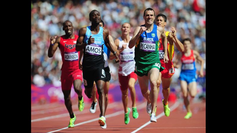 Nijel Amos, left, of Botswana and Fabiano Pecanha, right, of Brazil lead the field in the men's 800-meter heat Monday.