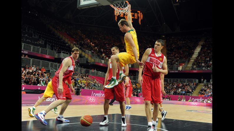 Australian forward Brad Newley scores during the men's basketball preliminary round match against Russia.