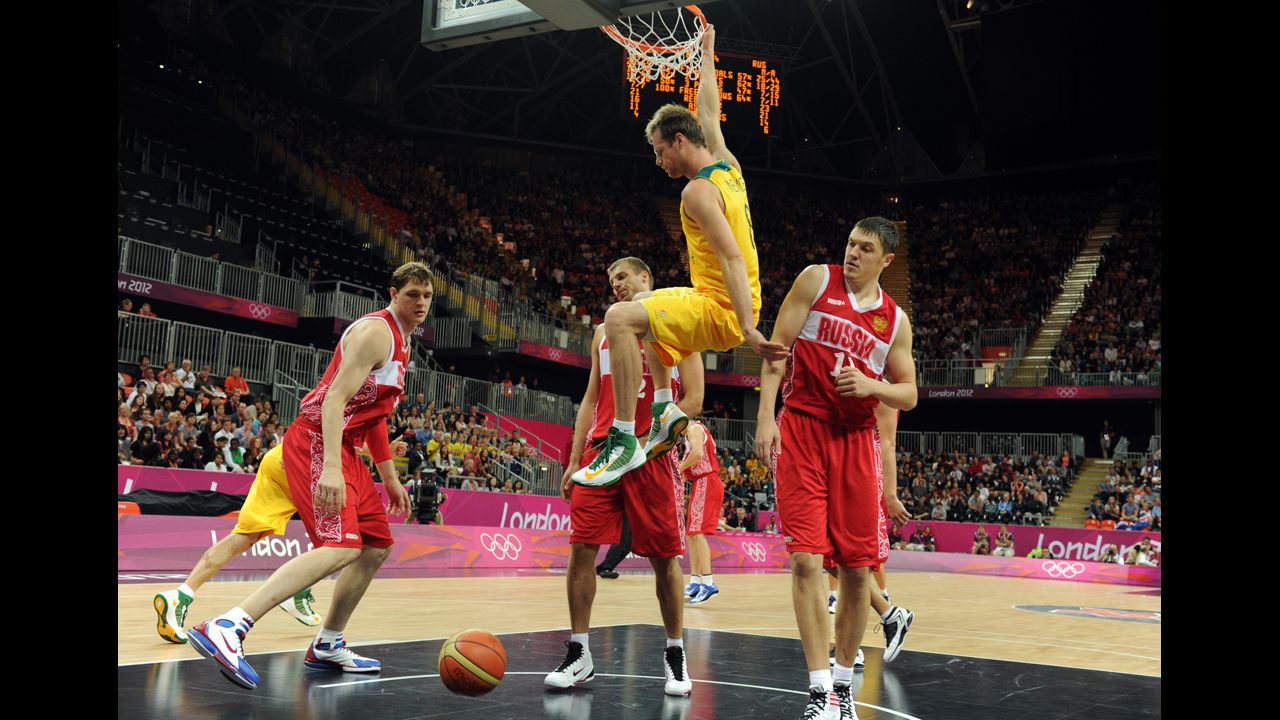 Australian forward Brad Newley scores during the men's basketball preliminary round match against Russia.