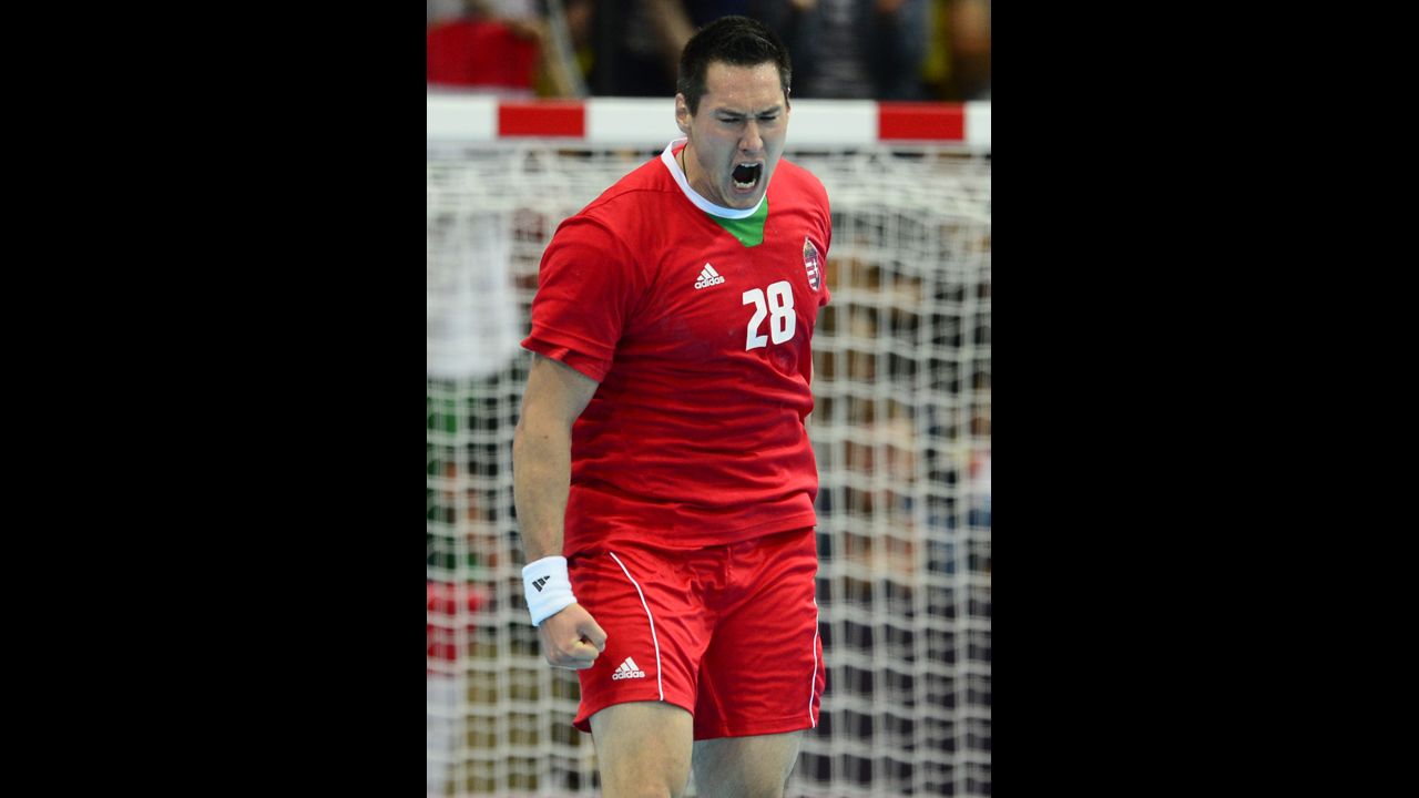 Timuzsin Schuch of Hungary celebrates a goal in the men's preliminary Group B handball match against Serbia.