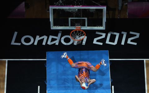 A performer dunks the ball during the halftime entertainment of the Russia and Australia men's basketball game.