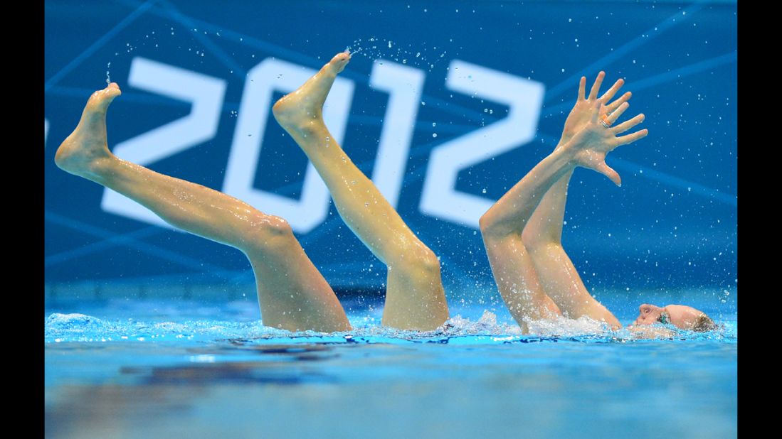 A synchronized swimmer performs her routine in 4 inches of water.