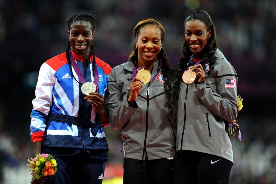 From left, silver medalist Christine Ohuruogu of Great Britain, gold medalist Richards-Ross and bronze medalist DeeDee Trotter of the United States show off their medals during Sunday's ceremony at Olympic Stadium in London.
