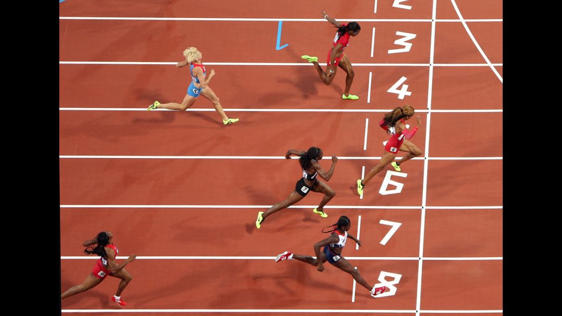 Richards-Ross crosses the line to win the gold.