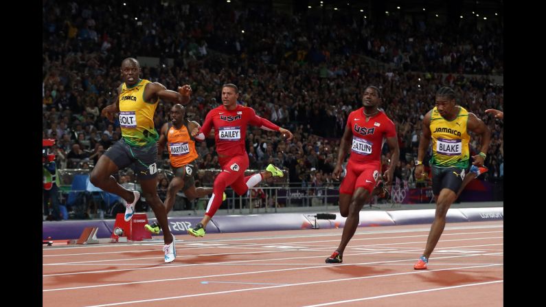 Usain Bolt of Jamaica crosses the finish line to win gold in the men's 100m final.