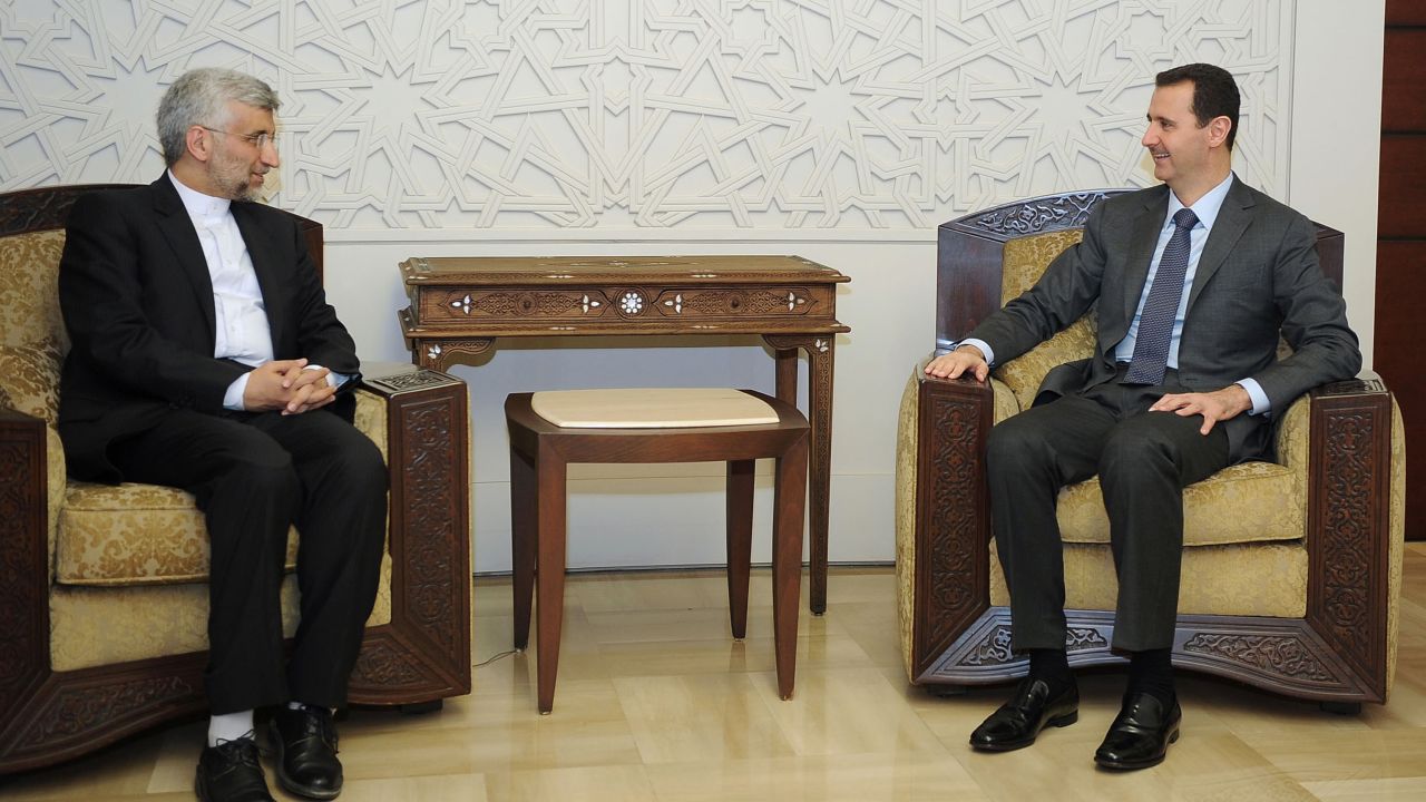 Syrian President Bashar al-Assad, right, meets with a top aide to Iran's supreme leader in Damascus on Tuesday.