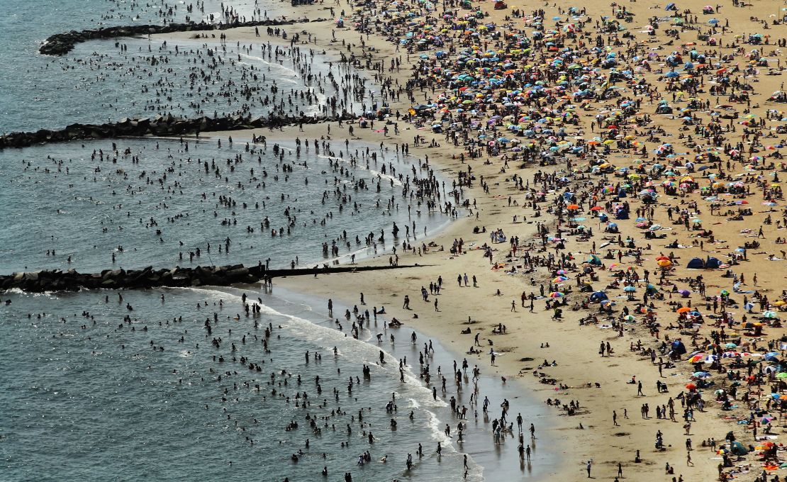 An aerial view of beachgoers taking in the sun at Coney Island in August 2012. (Photo by Mario Tama/Getty Images) 
