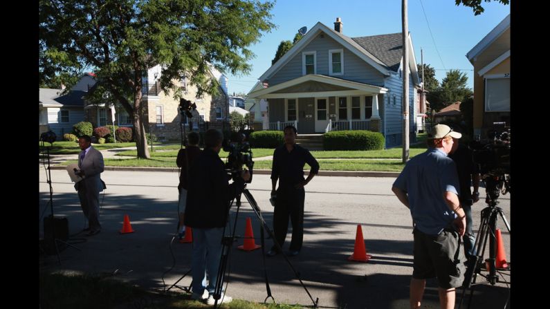 News crews report Monday from outside Page's home in Cudahy, Wisconsin.