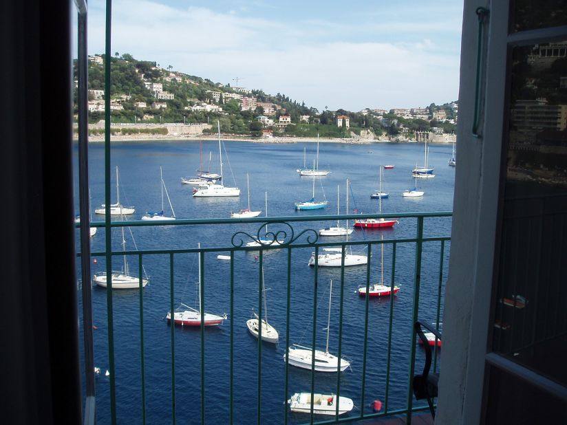 Provençal Waterfront Penthouse, one of seven Villefranche-sur-Mer apartments available for rent through Riviera Experience, offers unobstructed views of the Bay of Villefranche. 