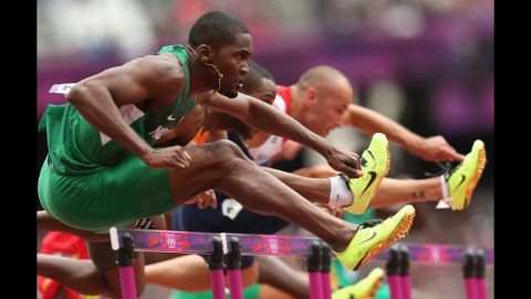 Left to right: Selim Nurudeen of Nigeria, Gregory Sedoc of Netherlands and Andrew Turner of Great Britain compete in the men's 110-meter hurdles round 1 heat on Tuesday, August 7. 
