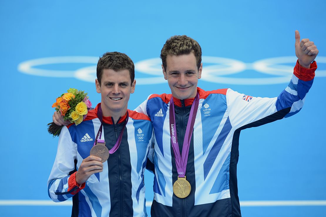 Alastair (R) and Jonny pose with their medals after the men's triathlon at the London 2012 Olympics.
