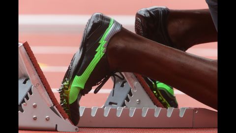 Usain Bolt of Jamaica waits in the starter block prior to the men's 200-meter round 1 heats.