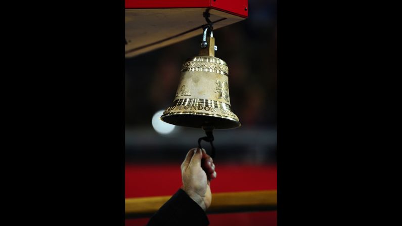 The bell signaling a final lap is rung during the men's keirin repechage cycling event at the velodrome in Olympic Park.