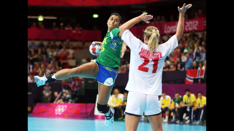 Fernanda Silva, left, of Brazil shoots over Goril Snorroeggen of Norway during the women's quarterfinal hand ball match.