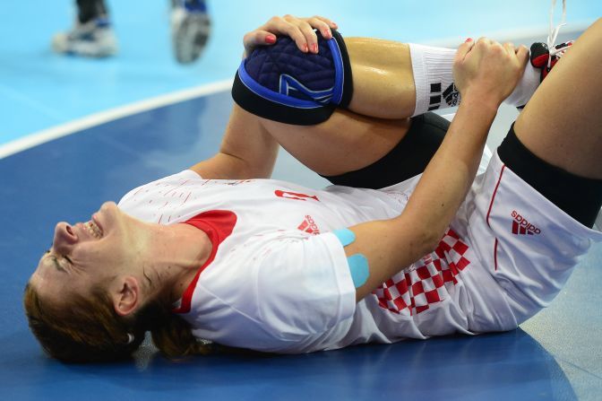 Croatia's centerback Miranda Tatari reacts after falling during the women's quarterfinal handball match against Spain.