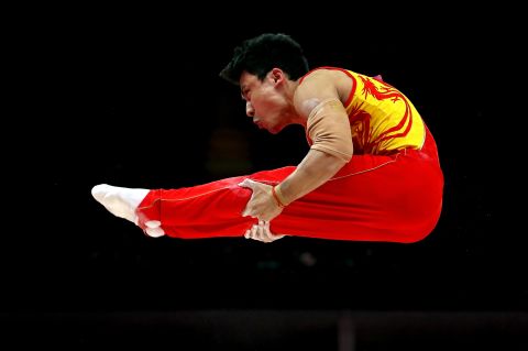 Chinese gymnast Zhe Feng competes on the parallel bars during the finals.