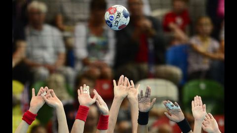 The Spanish handball team's defenders attempt to block the ball during the women's quarterfinal handball match against Croatia.