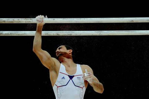 French gymnast Hamilton Sabot prepares to compete during the parallel bars final.