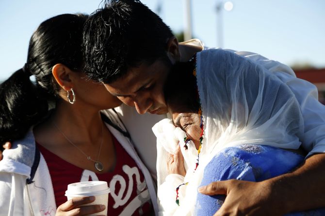 Amardeep Kaleka is consoled at the command center near the Sikh Temple of Wisconsin on Monday.