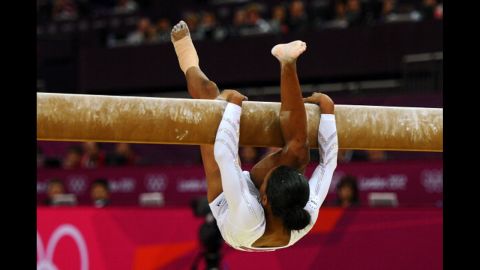 American gymnast Gabrielle Douglas falls off the beam during the women's beam final.