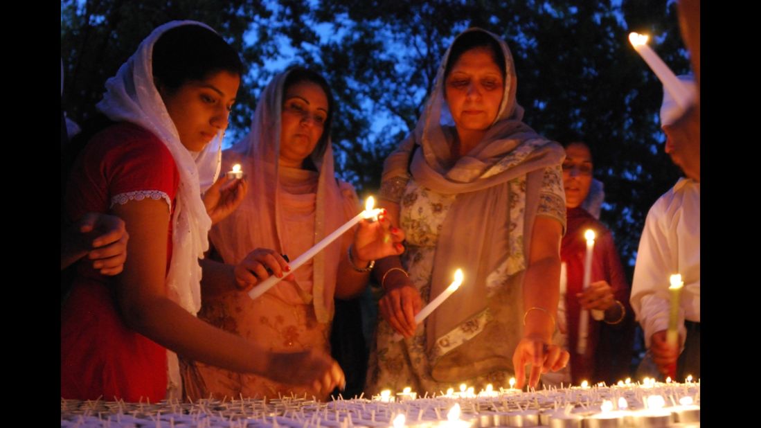 Members of Wisconsin's Sikh community conduct a candlelight vigil on Monday, August 6, for the six people killed in suburban Milwaukee.
