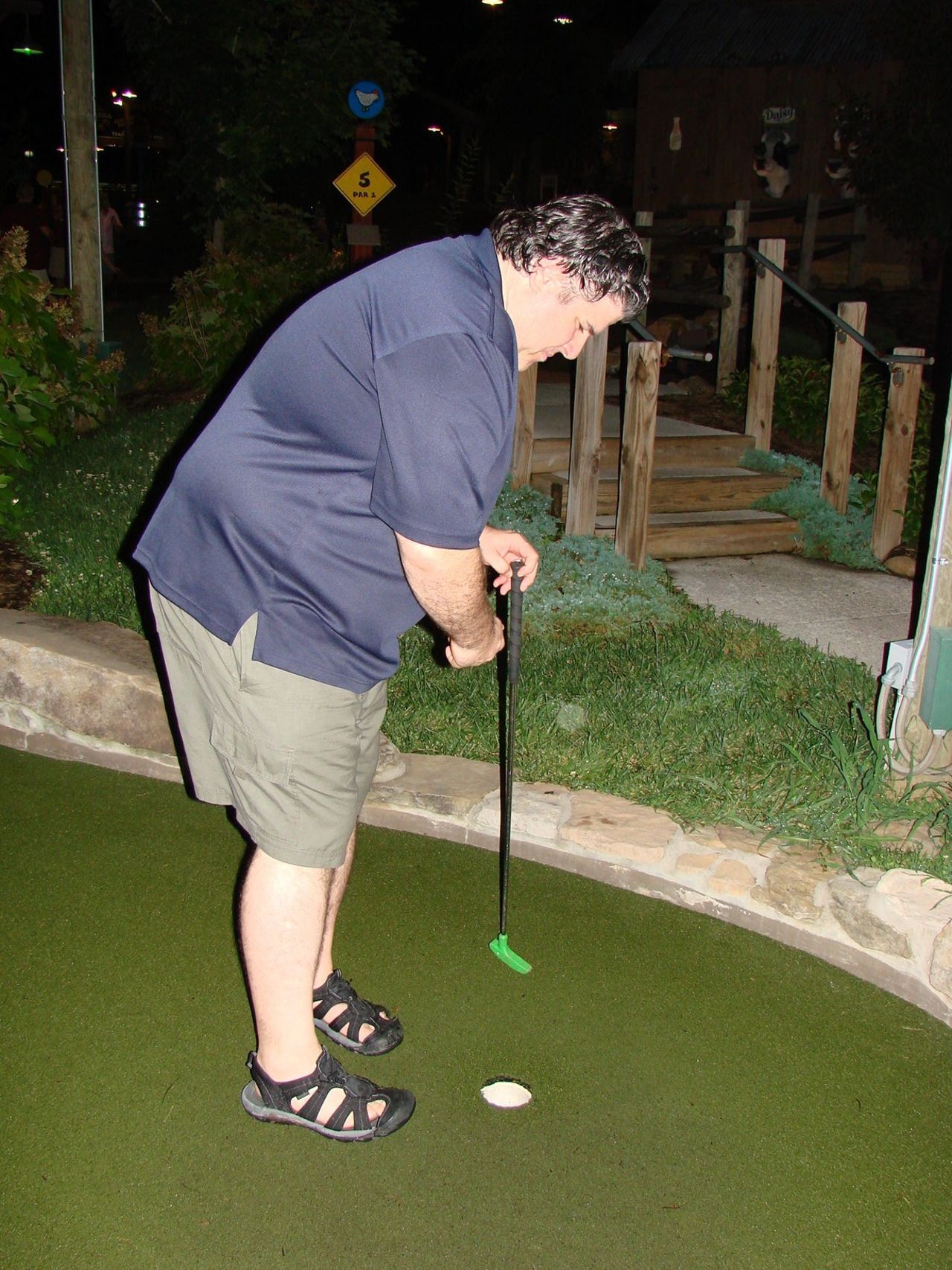 Rucker plays mini golf during a fateful trip to Gatlinburg, Tennessee, in 2010. He was unable to join his daughter on any of the rides at Dollywood. 