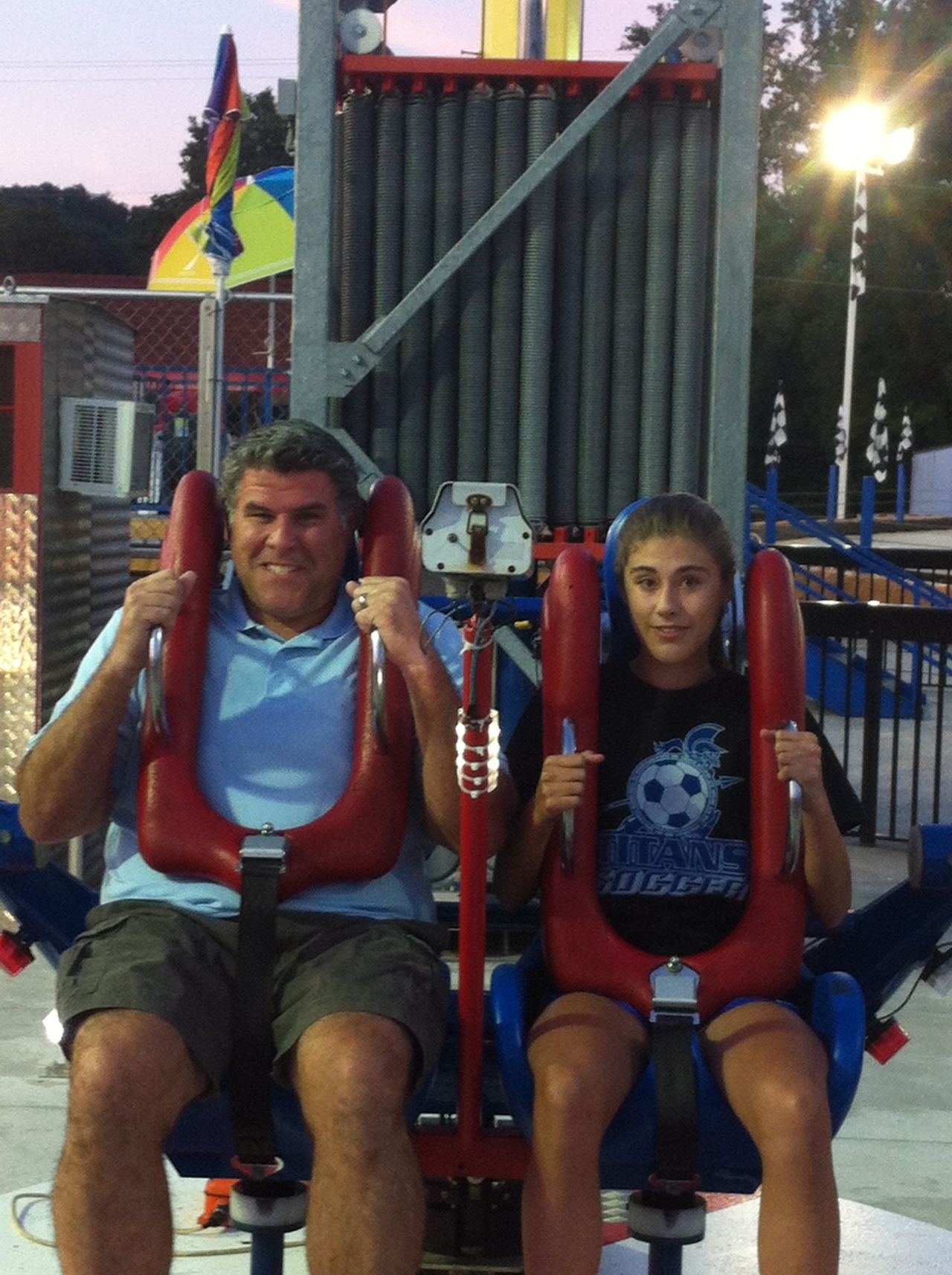 Mission accomplished: Rucker and his daughter ride the Sling Shot in Gatlinburg in June. 
