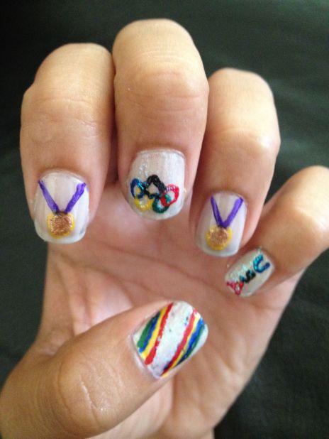 "I'd consider myself somewhat of a tomboy," said Sonia Silva of San Diego. "I thought it'd be cool to try to put a sporty spin on a girly hobby, and I decided to try Olympic themed nail art." The <a href="http://ireport.cnn.com/docs/DOC-825575">little gold medals</a> are especially cute!