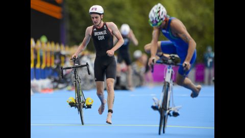 Great Britain's Alistair Brownlee, left, and Italy's Alessandro Fabian compete in the men's triathlon.