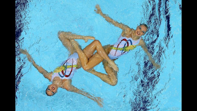 Mary Killman and Mariya Koroleva of the United States compete in the women's duets synchronized swimming free routine final.