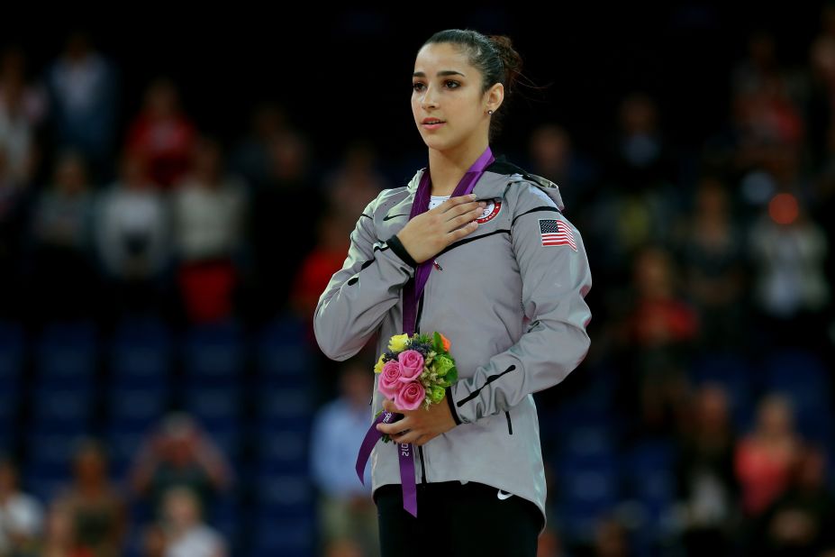 Gold medalist Alexandra Raisman poses on the podium during the medal ceremony for the women's gymnastics floor exercise final on Tuesday.