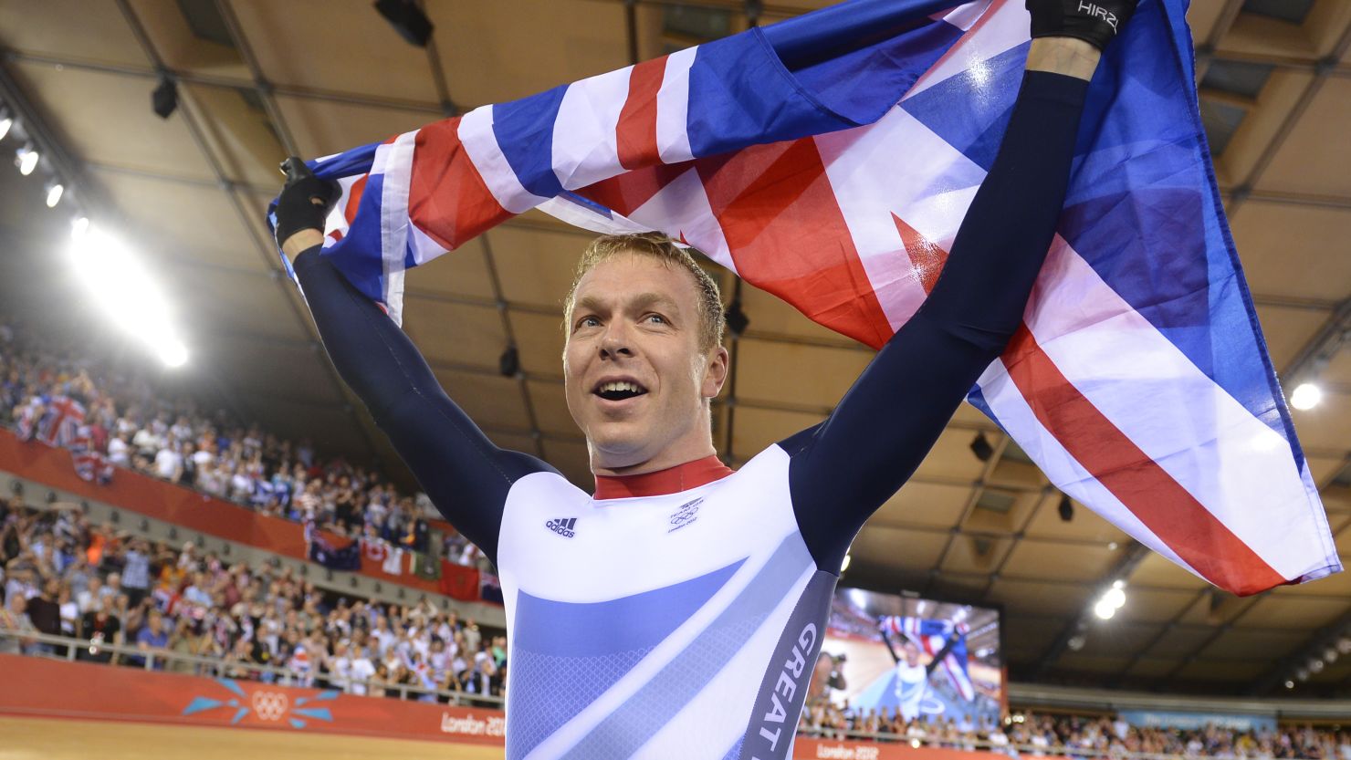 Chris Hoy poses with the Union Jack after becoming the most decorated Olympian in British history