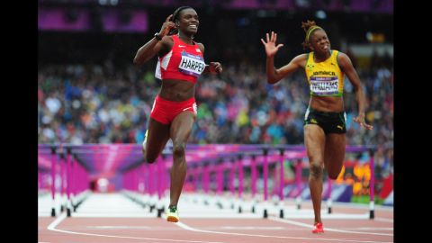 Dawn Harper of the United States leads Shermaine Williams of Jamaica in the women's 100-meter hurdles semifinals.