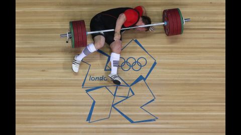 Matthias Steiner of Germany lies on the floor after failing to lift in the men's +105 kilogram weightlifting final.
