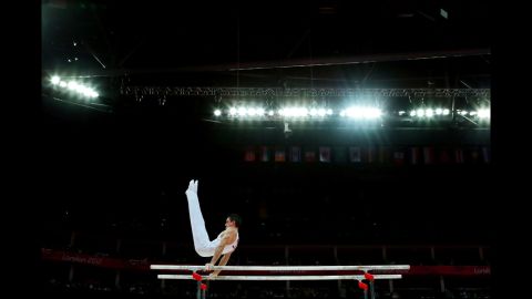 Hamilton Sabot of France competes on the parallel bars during the gymnastics men's parallel bars final.