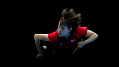 Kasumi Ishikawa of Japan competes against Ning Ding of China during the women's team table tennis gold medal match.
