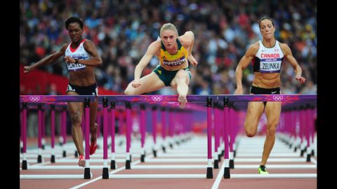 Sally Pearson of Australia leads Tiffany Porter of Great Britain and Jessica Zelinka of Canada in the women's 100-meter hurdles semifinals.