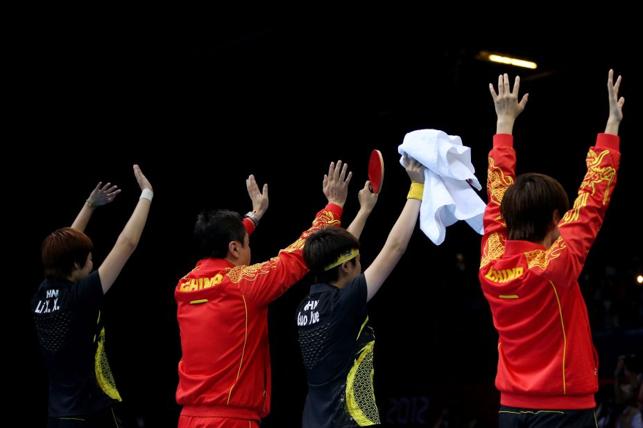 British gangsters (not shown) rob the Chinese table tennis team at gunpoint.