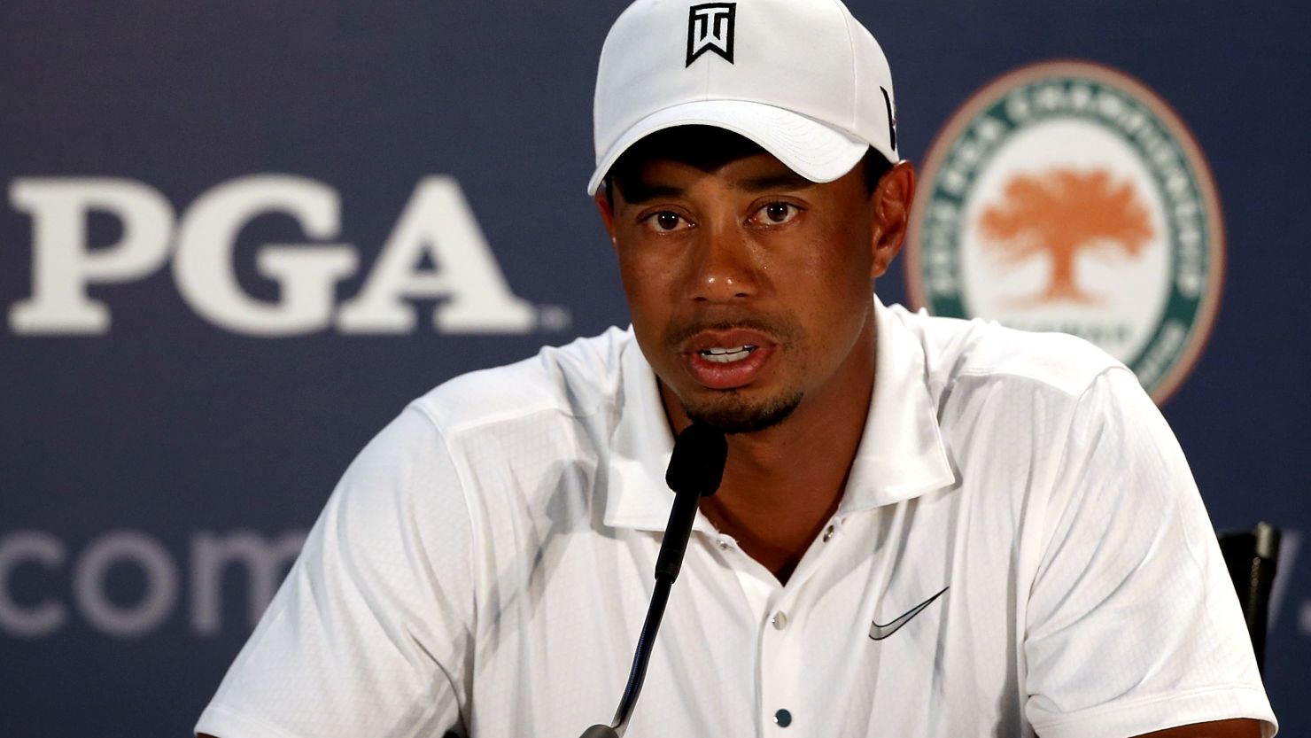  Tiger Woods talks to reporters after a practice round ahead of the 94th PGA Championship at the Ocean Course.