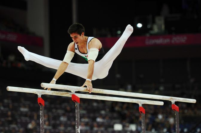 Daniel Corral Barron of Mexico competes in the men's parallel bars final.