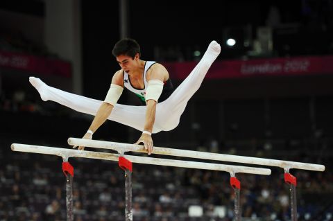 Daniel Corral Barron of Mexico competes in the men's parallel bars final.