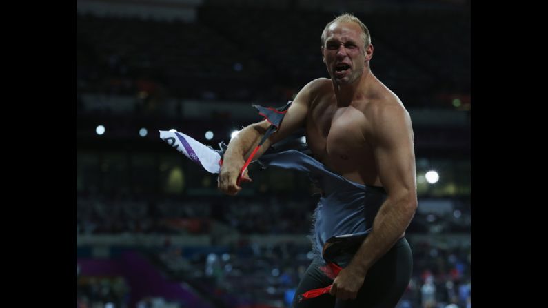 Robert Harting of Germany celebrates winning gold in the men's discus throw final.