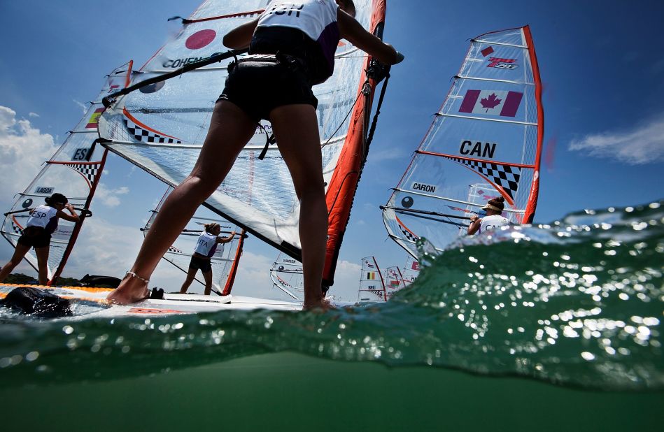 The windsurfing lobby argues that kiteboarding lacks a clear pathway from junior to professional level, something that windsurfing has worked years to achieve. These teenage girls are competing in the Techno 293 windsurfer class at the Youth Olympics in Singapore.